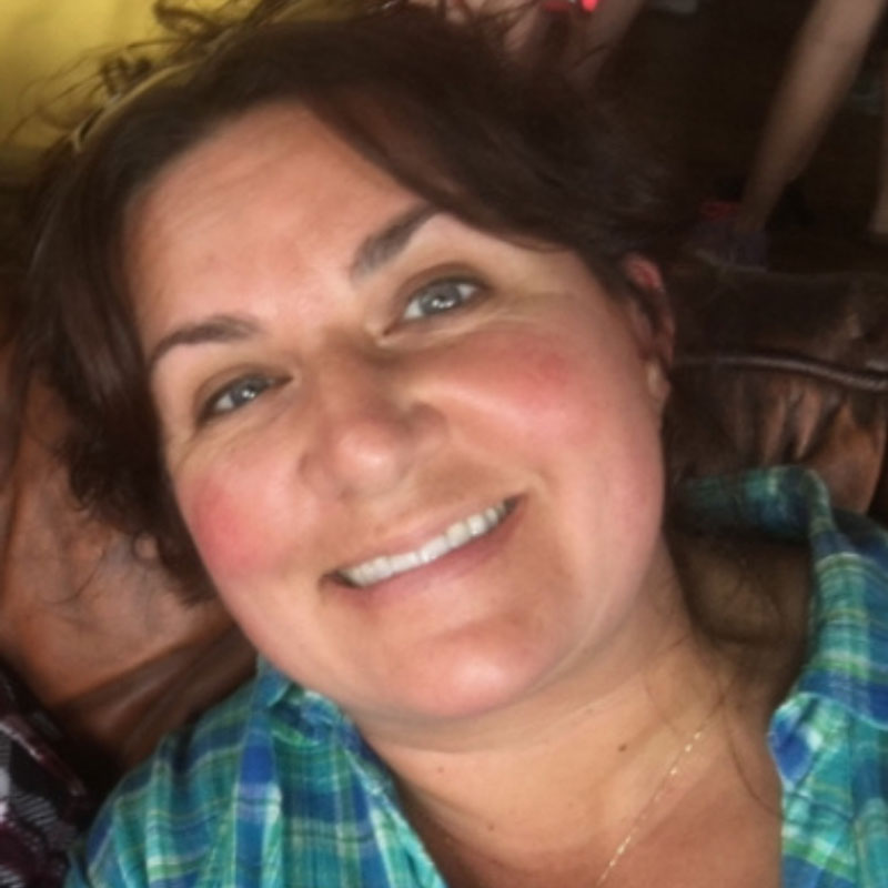 Woman smiling.